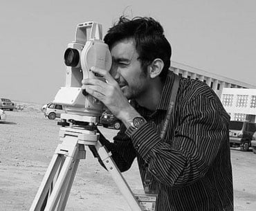 A student using a theodolite in field